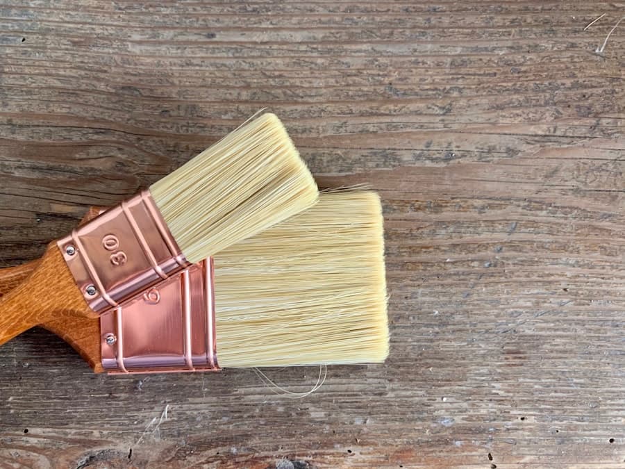 Wooden-handled brush laid across a freshly finished timber surface