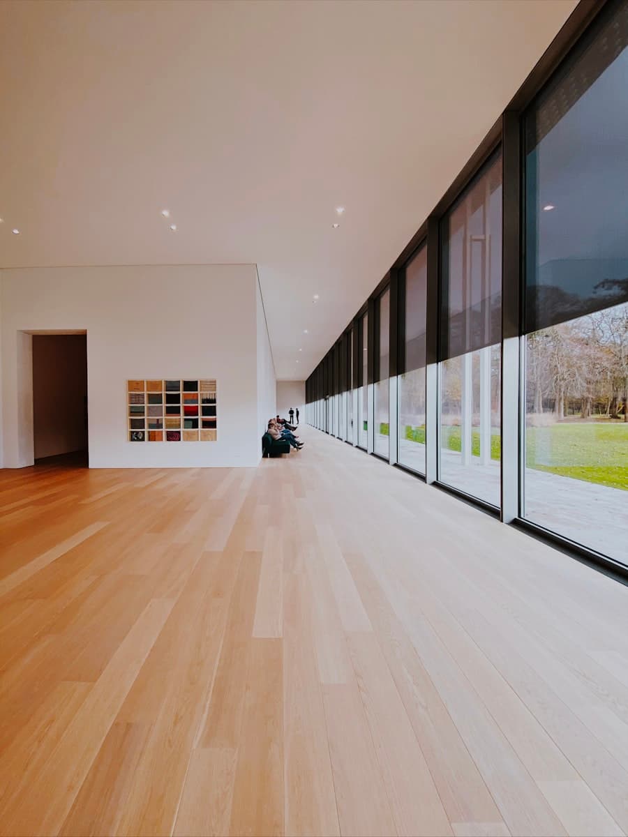 Light plank flooring running through a bright open room